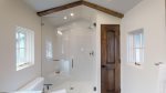 Gorgeous walk in tiled shower with glass door